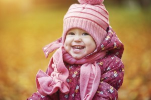 happy baby girl child outdoors in the park in autumn